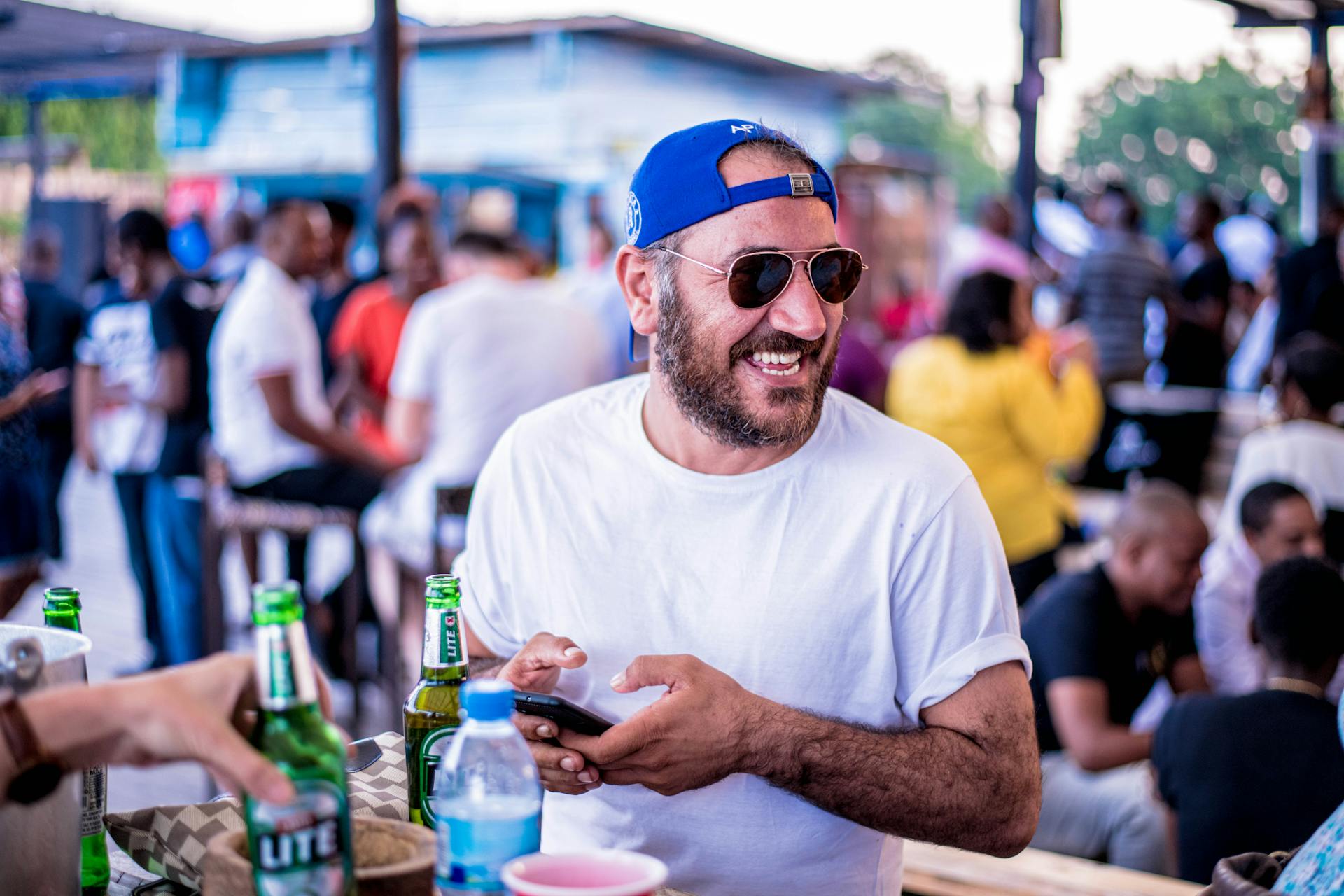 Man Wearing Blue Cap and White Shirt